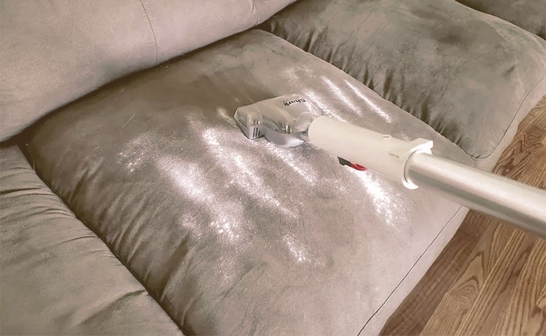 Vacuuming Couch with Baking Soda